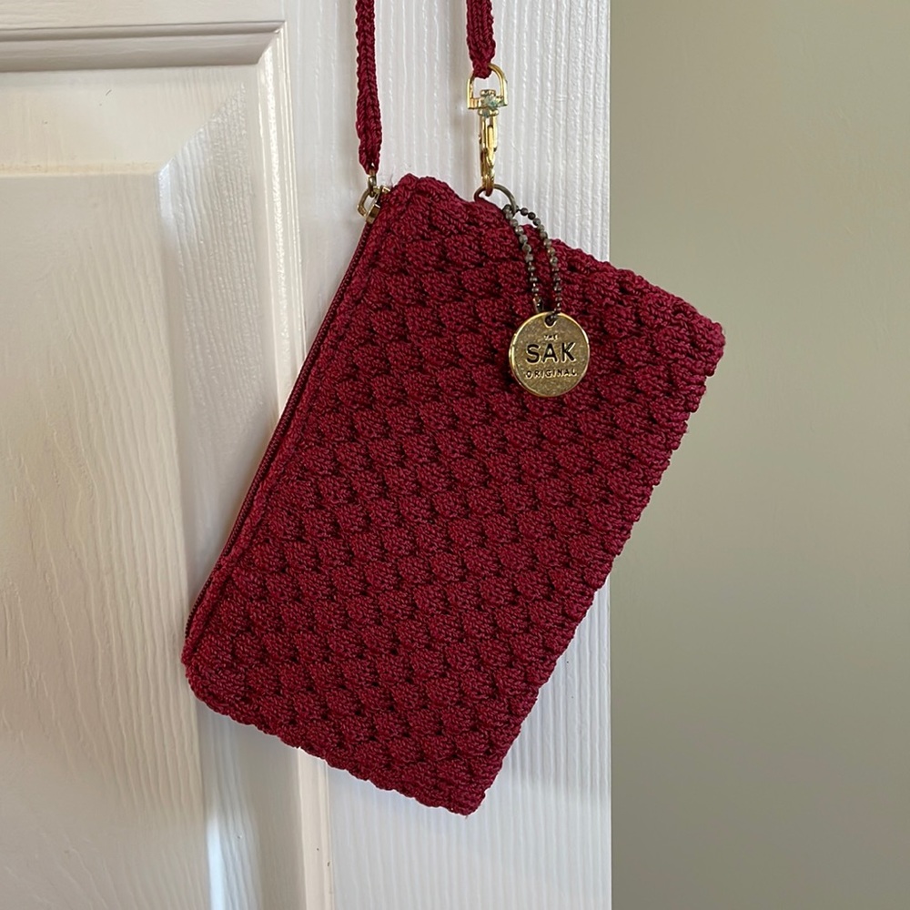 Red woven wristlet/bag from The Sak